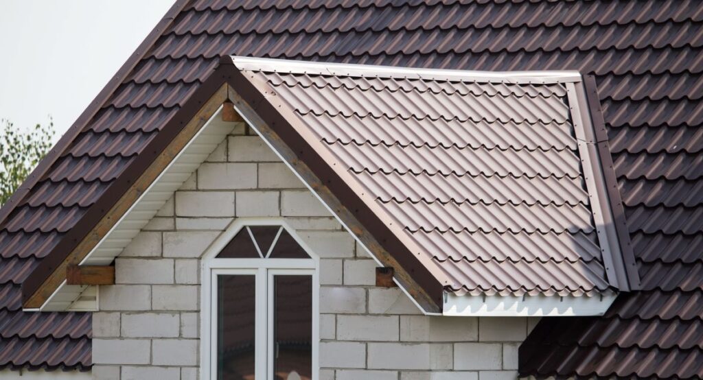white brick house with metal tile roof