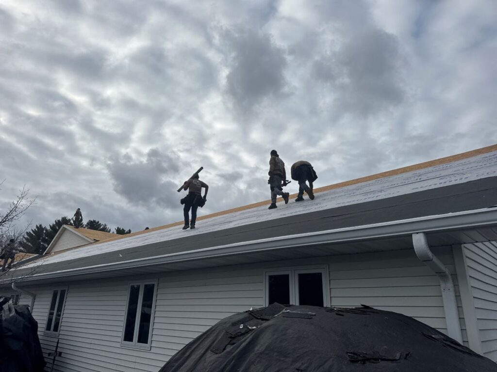 roofers replacing a roof