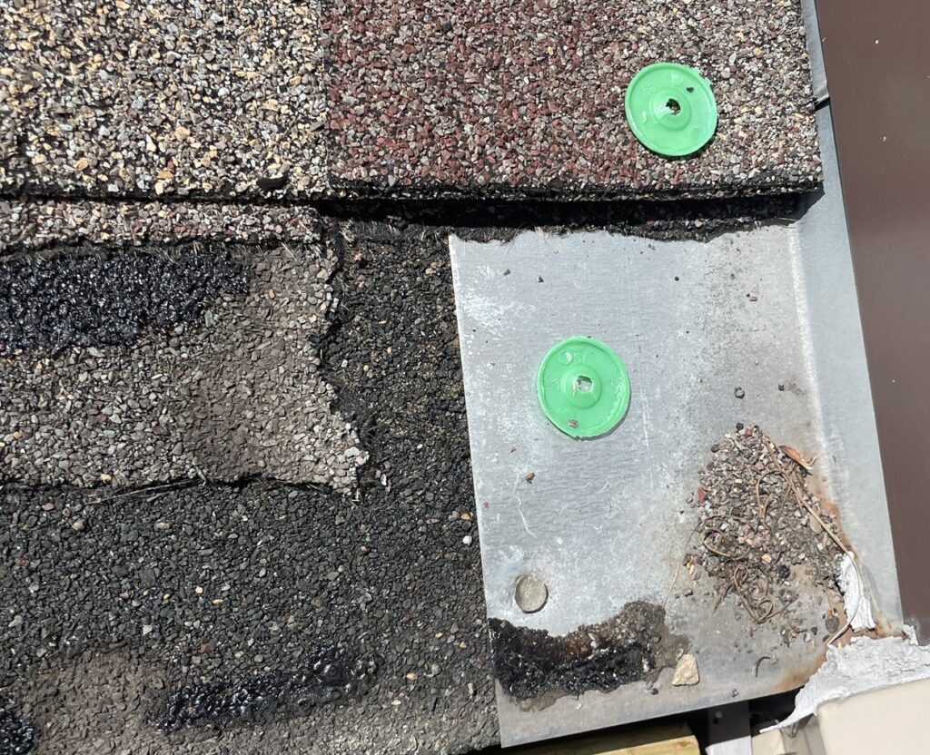 damaged roof with missing shingles