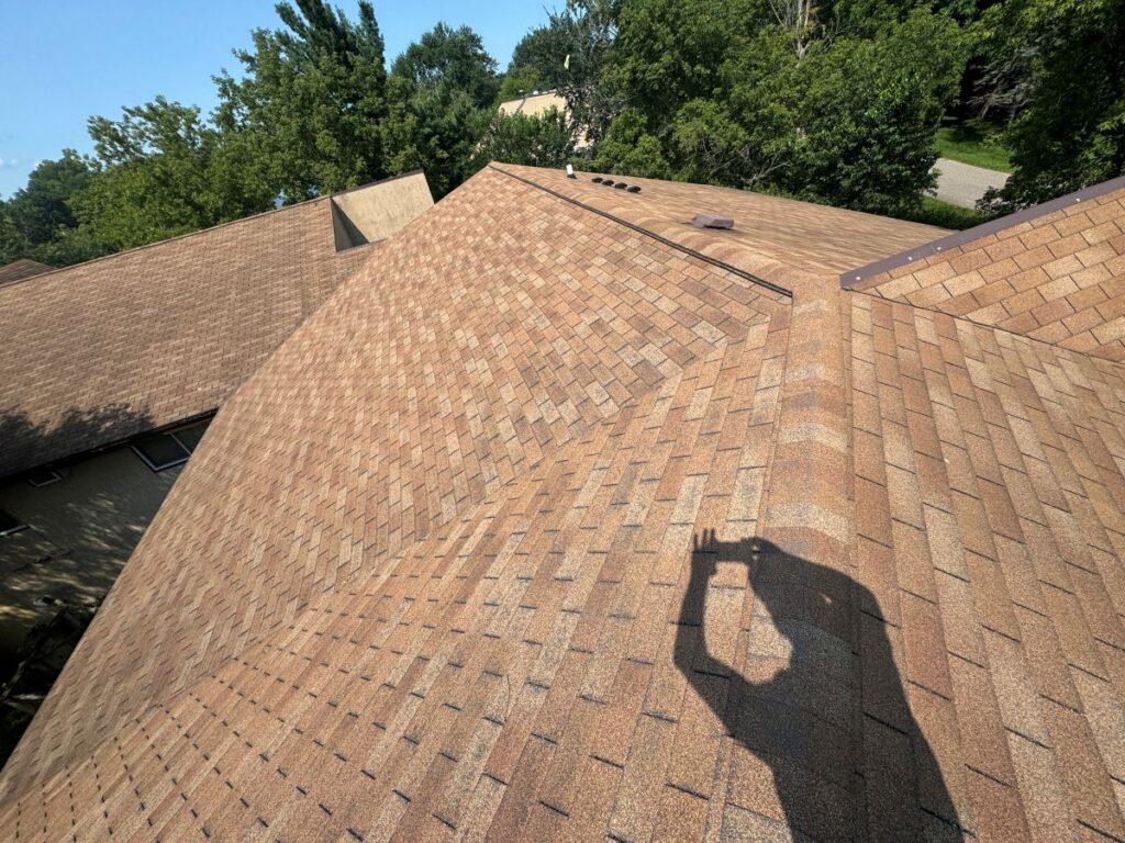 asphalt roof being inspected