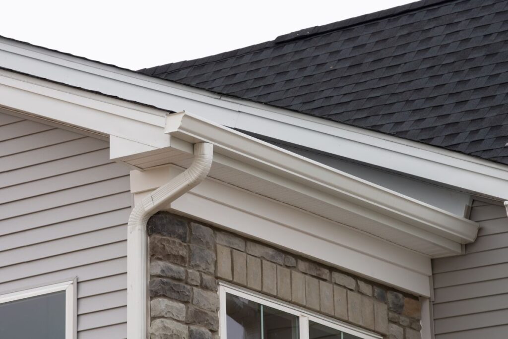 white plastic rain guttering system guttering drainage pipe exterior background of sandwich panel