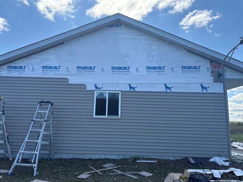 new vinyl siding being installed